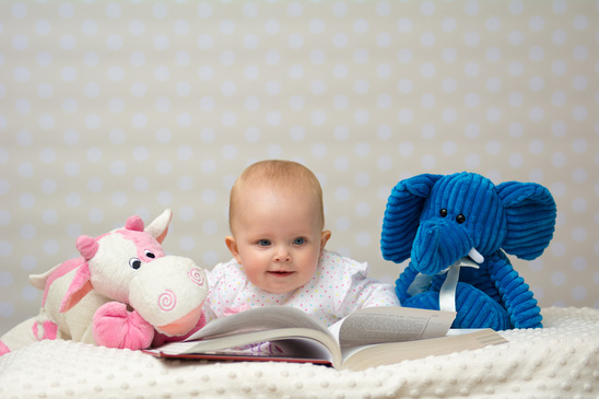 photodune-11106968-baby-girl-reading-a-book-xs.jpg