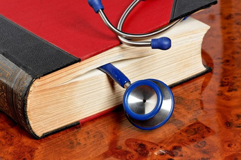 photodune-1815142-stethoscope-is-located-in-a-medical-book-xs.jpg