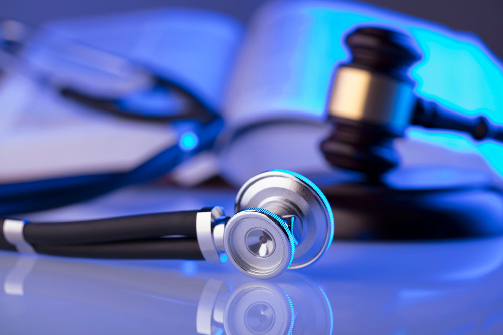 gavel and stethoscope with a blue overlay